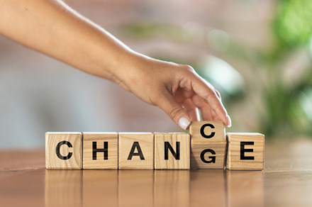 Wooden cubes, blocks with word Change in female hand. Conceptual image about hu, a Business Photo by Volodymyr Melnyk
