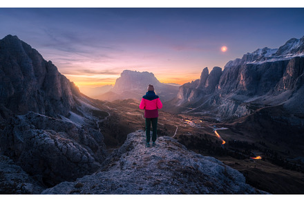 Woman on the rock and mountain peaks, a Person Photo by den-belitsky