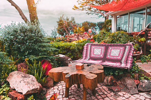 Garden bench with crochet blanket, an Architecture Photo by SkyNext