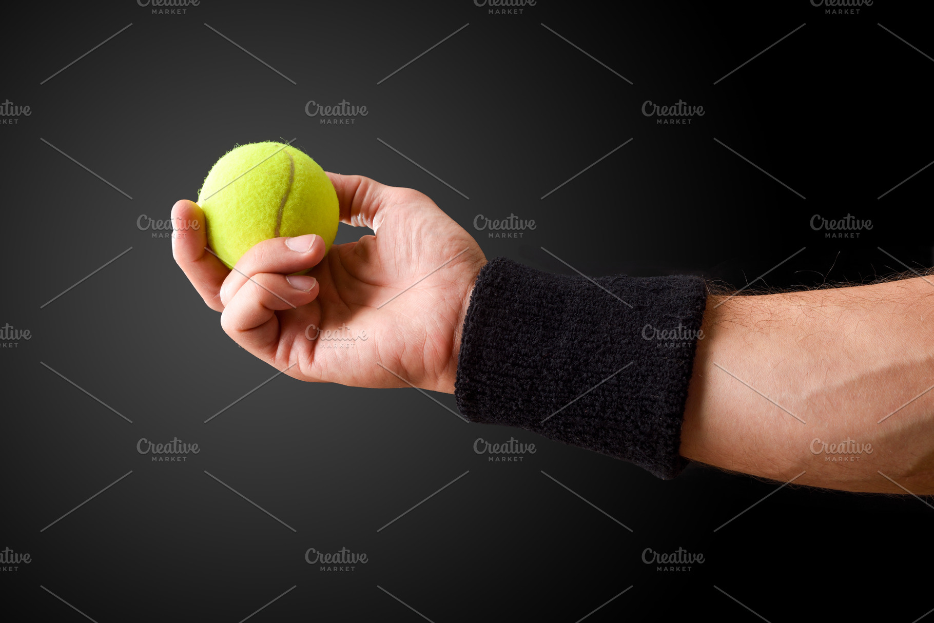 Hand Holding a Tennis Ball with Wristband, a Sports & Recreation Photo by Davizro's Market