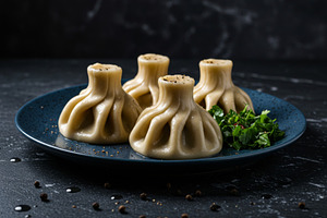 Traditional khinkali dumplings serve, a Food & Drink Photo by professorinc