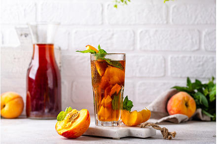 Cold ice tea with peach and mint, a Food & Drink Photo by Yulia Furman