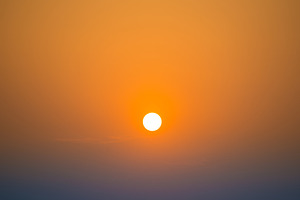 Sunset in the sky with big sun, a Nature Photo by Vapi
