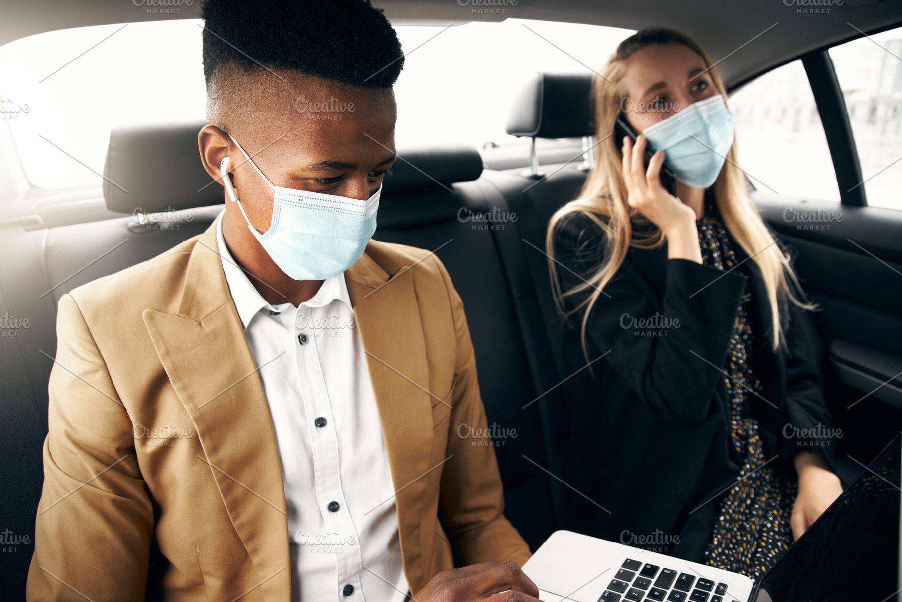 Business Couple Wearing Masks Using, a Photo by Southworks
