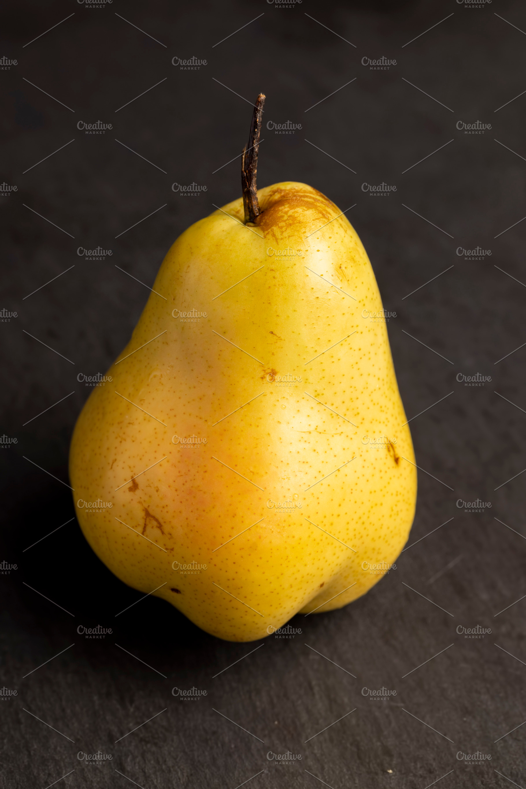 ripe green and yellow pear on a board, a Photo by MyPhotos