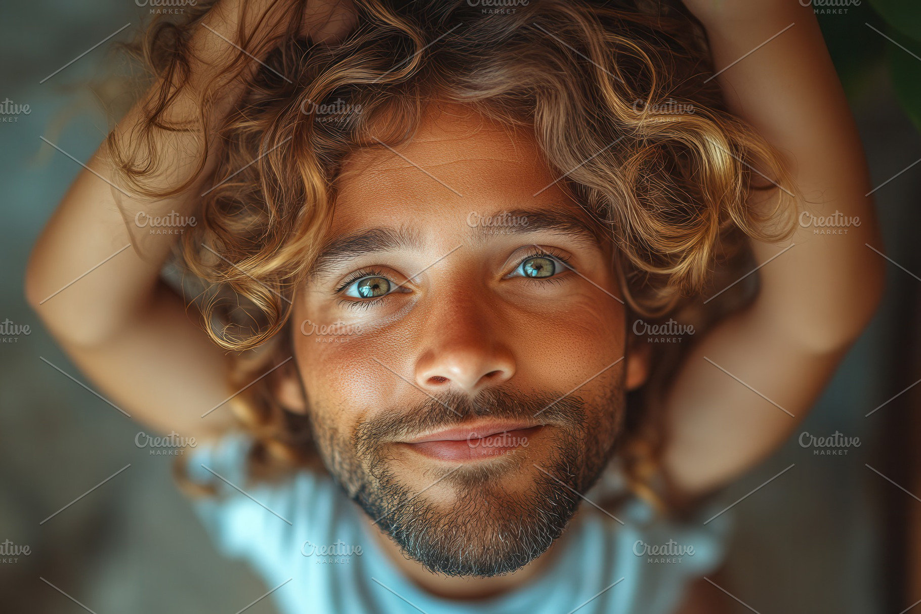 Man with curly hair and blue eyes sm, a Photo by Tanuart