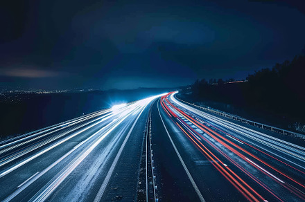 Vibrant light trails from vehicles i, a Photo by Tanuart