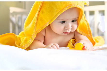 Baby after bathing in a towel, a Person Photo by yanadjana