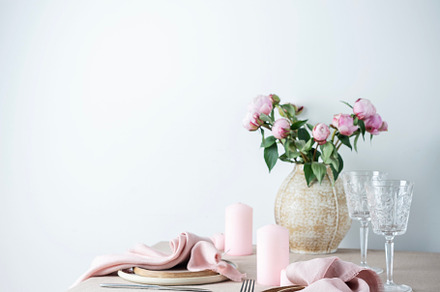 table with linen tablecloth in beige color