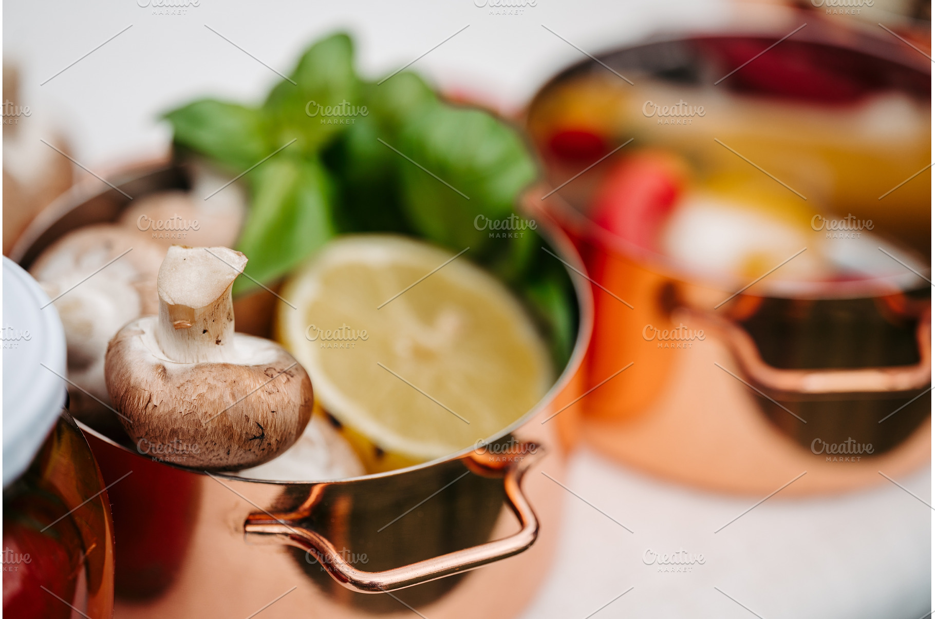 Fresh ingredients in copper pots, a Food & Drink Photo by HalfPoint