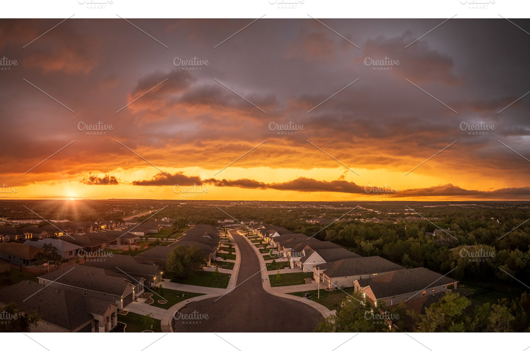 Dramatic storm clouds lit by setting, an Architecture Photo by Backyard Stock