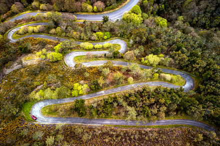 Aerial view curve road on the mountains in Asturias, Spain., a Transportation Photo by CreativePhotoSpain