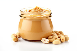 Glass jar with peanut butter on white background, a Food & Drink Photo by AlyaAnd