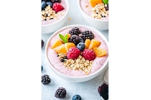 Fresh berry smoothie bowl with, a Food & Drink Photo by Lermont51