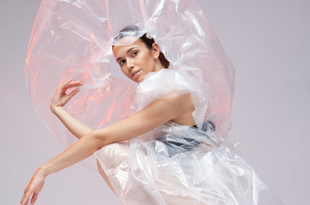 Girl posing in a dress made of featuring vogue, fashion, and plastic
