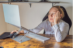Woman working in her home office, a Technology Photo by Elizaveta Galitskaya