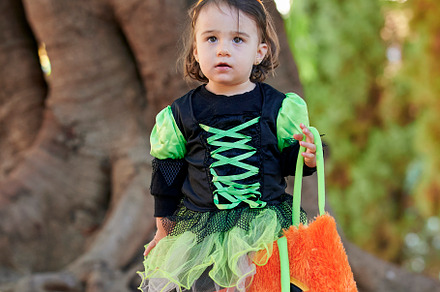 Baby in halloween costume outdoors