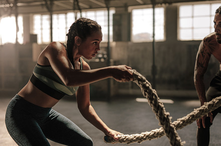 Woman doing battle rope workout, a Sports & Recreation Photo by Jacob Lund