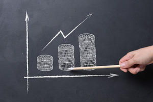 A person's hand with a pencil points to a chalked growth chart w, a Business Photo by ndanko