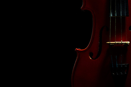 Violin with notes and bow on a black background containing music, musical, an Arts & Entertainment Photo by oleghz