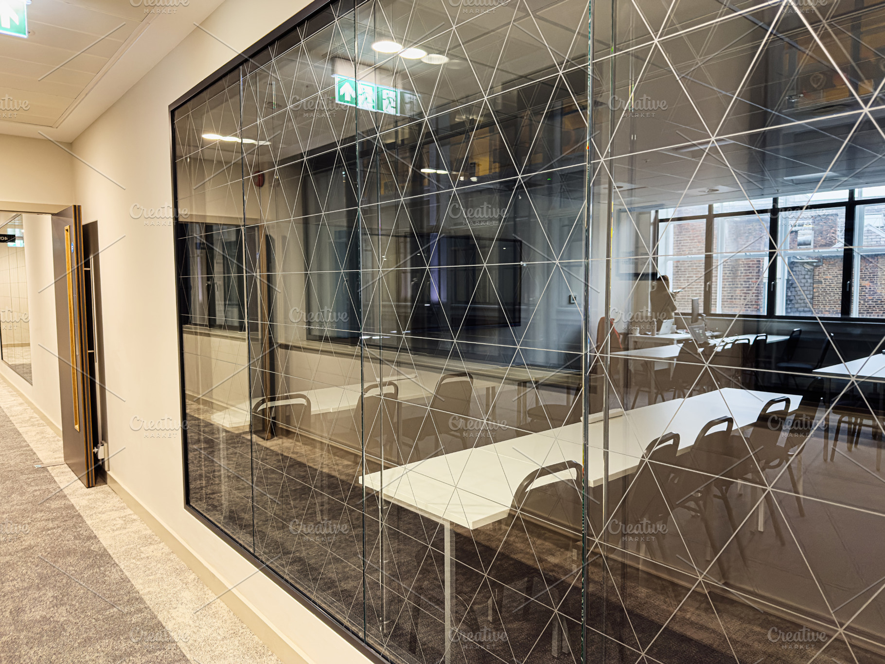 Modern glass conference room with a geometric patterned wall in a Manchester of, a Photo by AS photostudio
