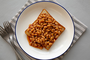 Homemade English Beans on Toast, top view., a Food & Drink Photo by LiudmylaChuhunova
