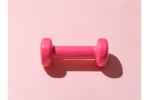 Fitness concept. Pink dumpbells on, a Sports & Recreation Photo by Fascinadora