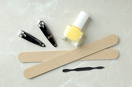 Concept of nail care with manicure accessories on light textured, a Beauty & Fashion Photo by AtlasStudio PRO