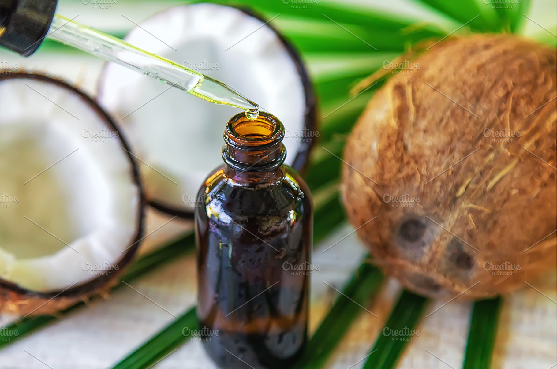 Natural coconut oil in a bottle, a Food & Drink Photo by yanadjana