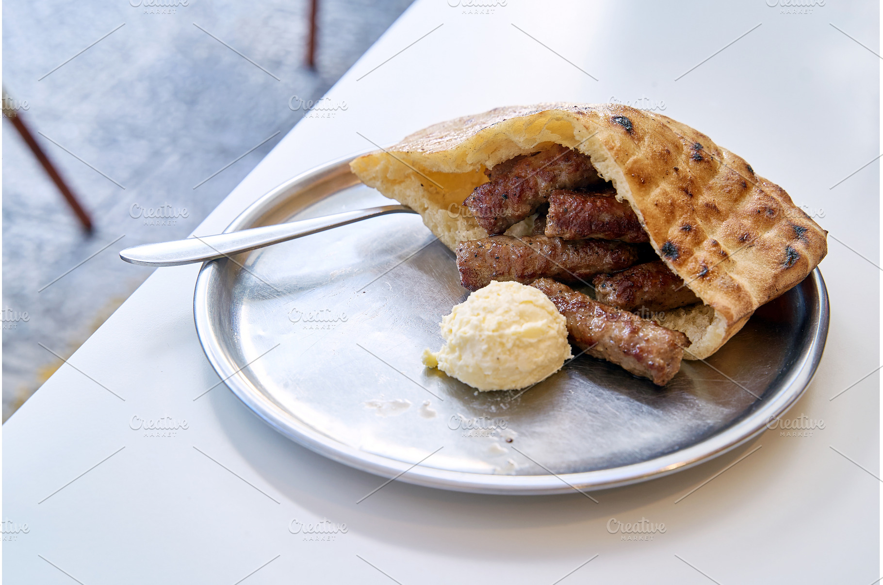 Sarajevo-style cevapi aka Sarajevski, a Food & Drink Photo by Oleksandr Berezko