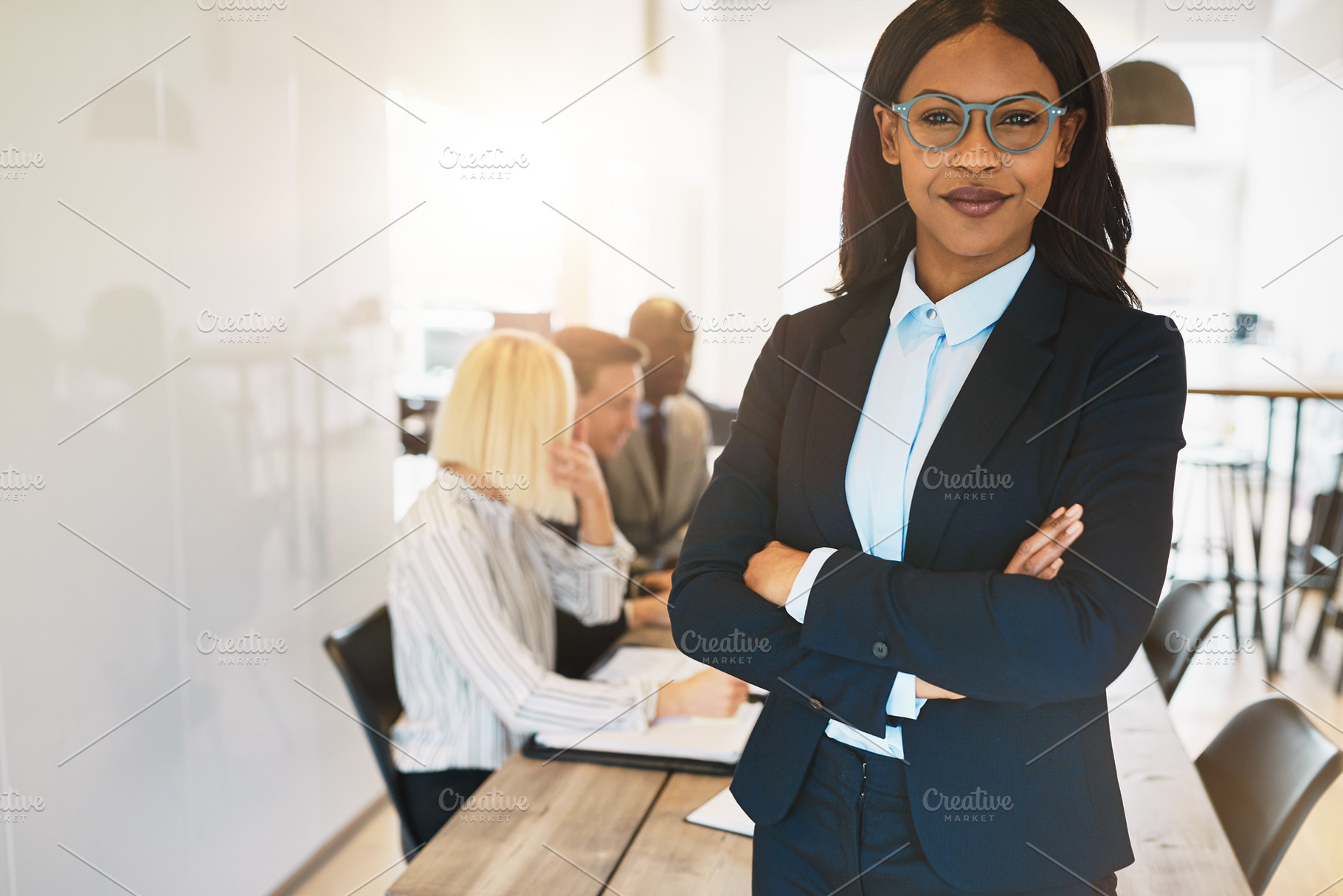 African businesswoman in a boardroom, a Business Photo by Stefan & Janni
