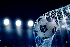 Closeup of soccer ball in goal net, a Sports & Recreation Photo by hitdelight