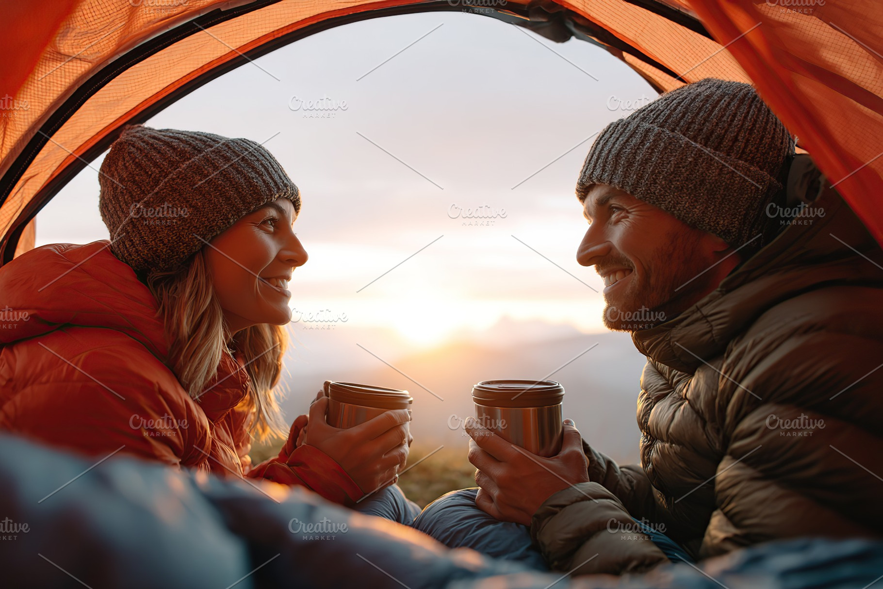 Couple enjoying warm drinks while camping at sunrise in a cozy tent on a mounta, a Photo by AlyaAnd