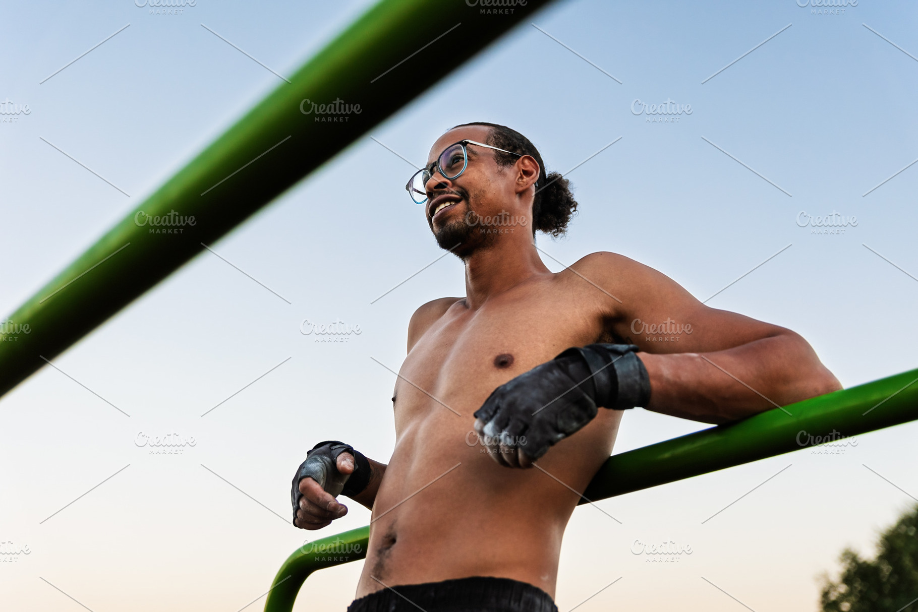 Smiling athlete on an outdoor calist, a Sports & Recreation Photo by Perpis
