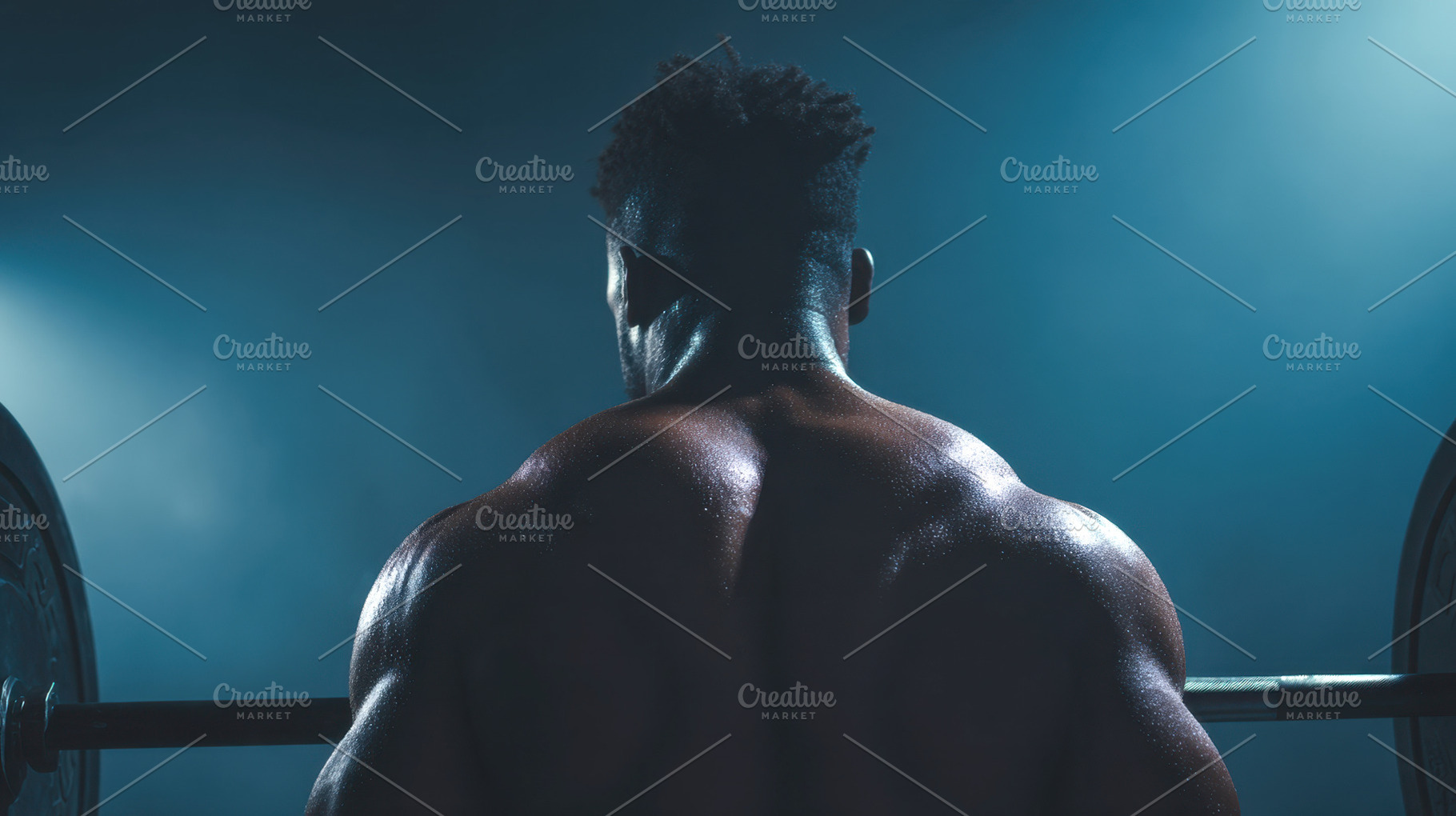 Strong man lifting weights in gym, a Photo by Beautiful things