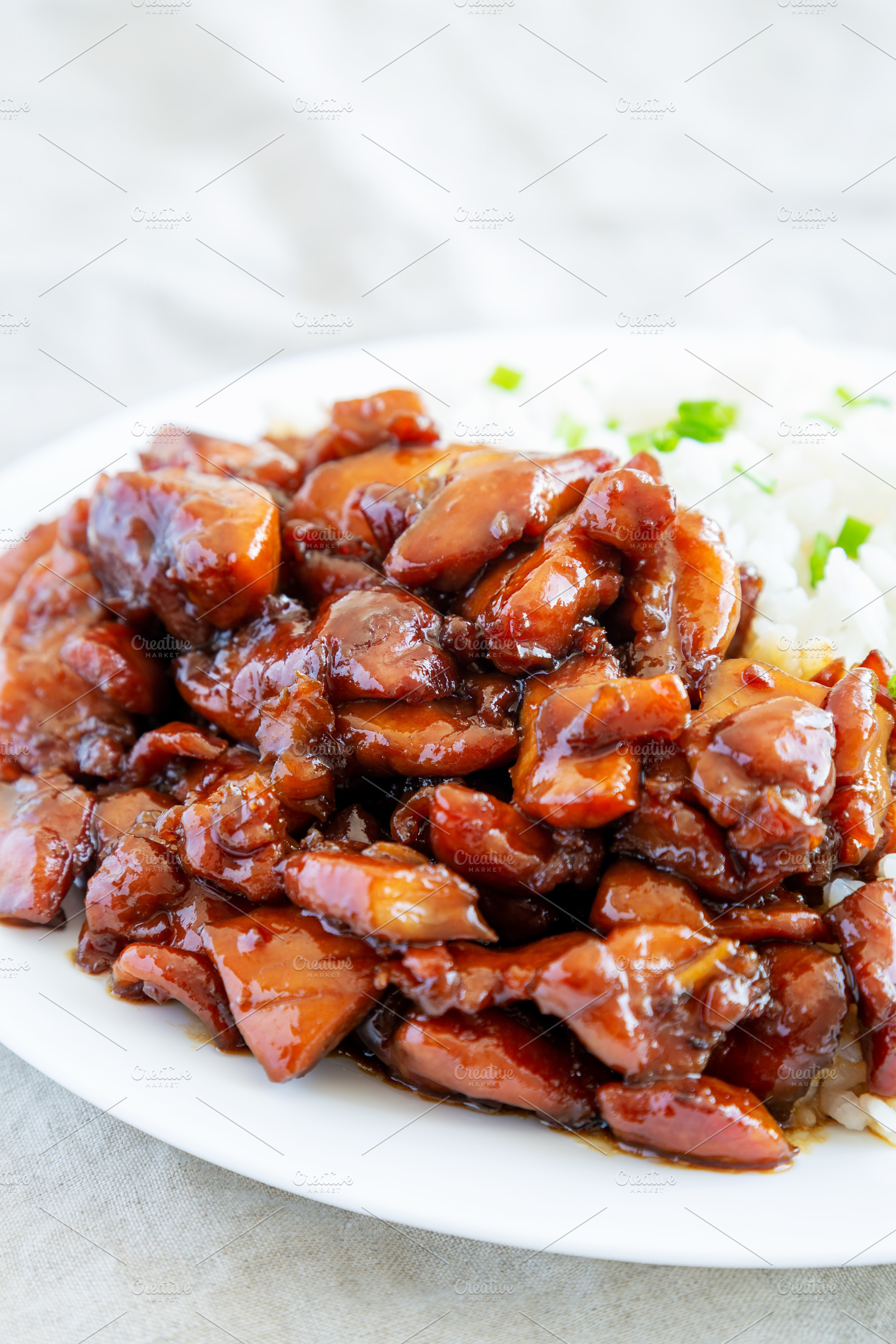 Homemade Teriyaki Chicken with White Rice on A Plate, side view., a Food & Drink Photo by LiudmylaChuhunova