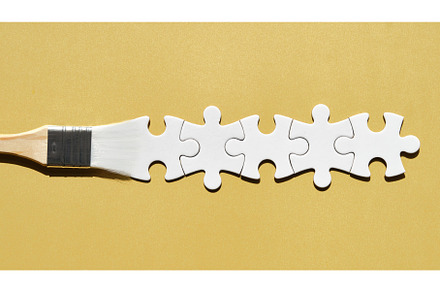 Paint brush with jigsaw puzzle paint, a Holiday Photo by tilialucida