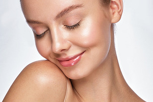 Beautiful young girl with a light containing care, makeup, and spa