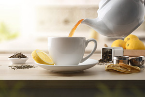 Serving tea from ceramic teapot on a wooden kitchen counter, a Food & Drink Photo by Davizro's Market