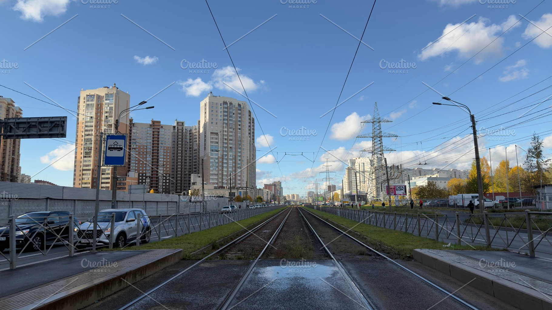 A view of railway tracks leading into the distance, flanked by modern buildings, an Industrial Photo by Textures & Backgrounds