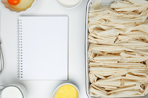 Mockup design for recipe or food blog. Cooking ingredients and notebook on a wh, a Photo by matucha