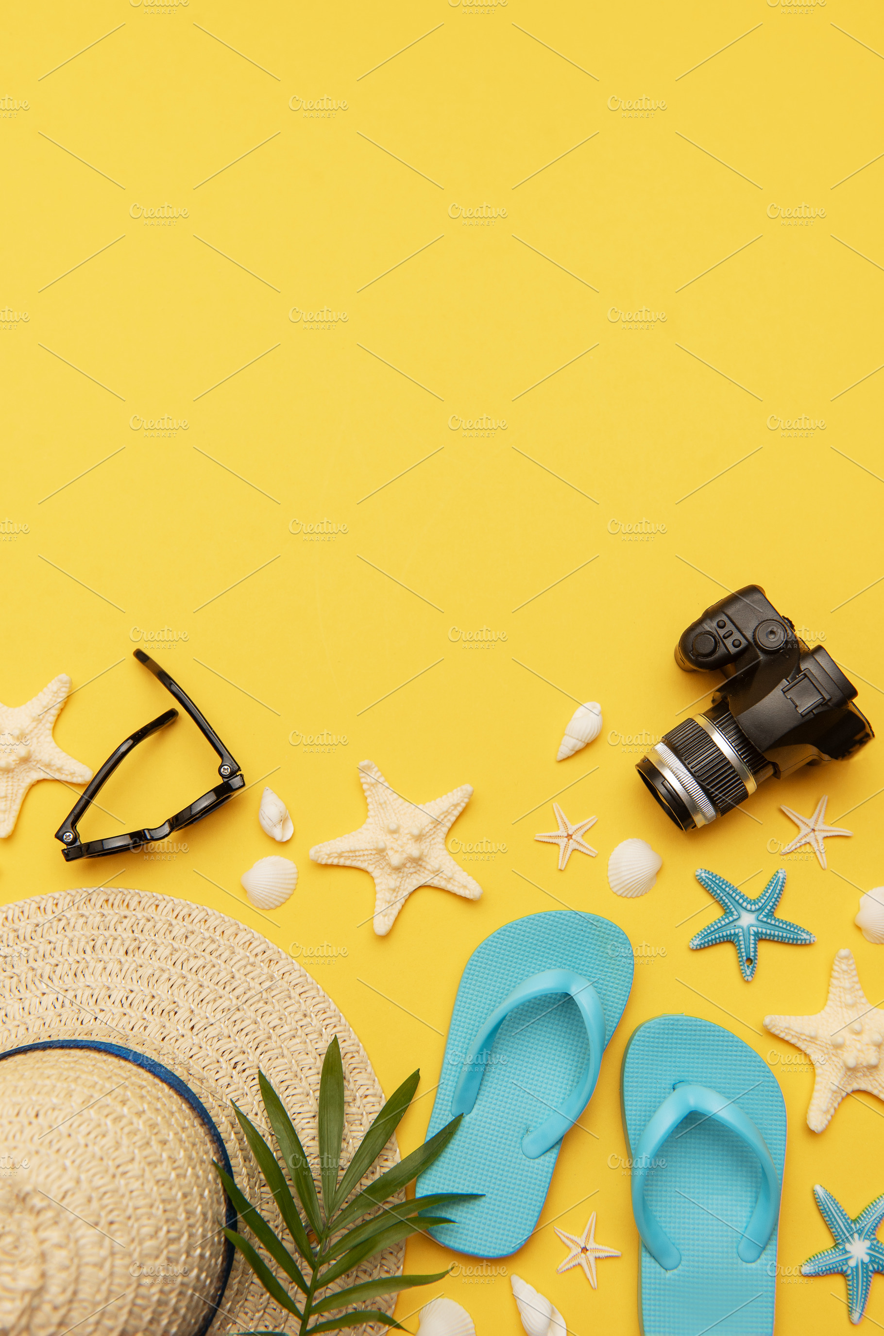 Summer holiday accessories lying on vibrant yellow background wi, a Holiday Photo by Olena Rudo