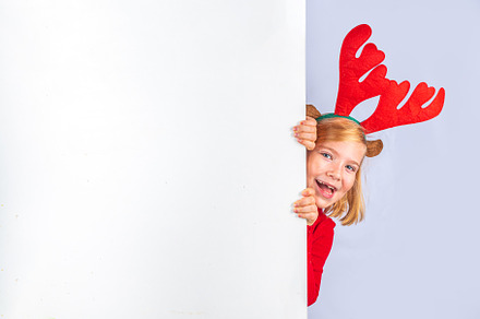 Christmas holiday background with funny girl, a Holiday Photo by Rimma