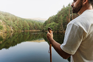 Man contemplating a lake in a mounta, a Person Photo by Perpis