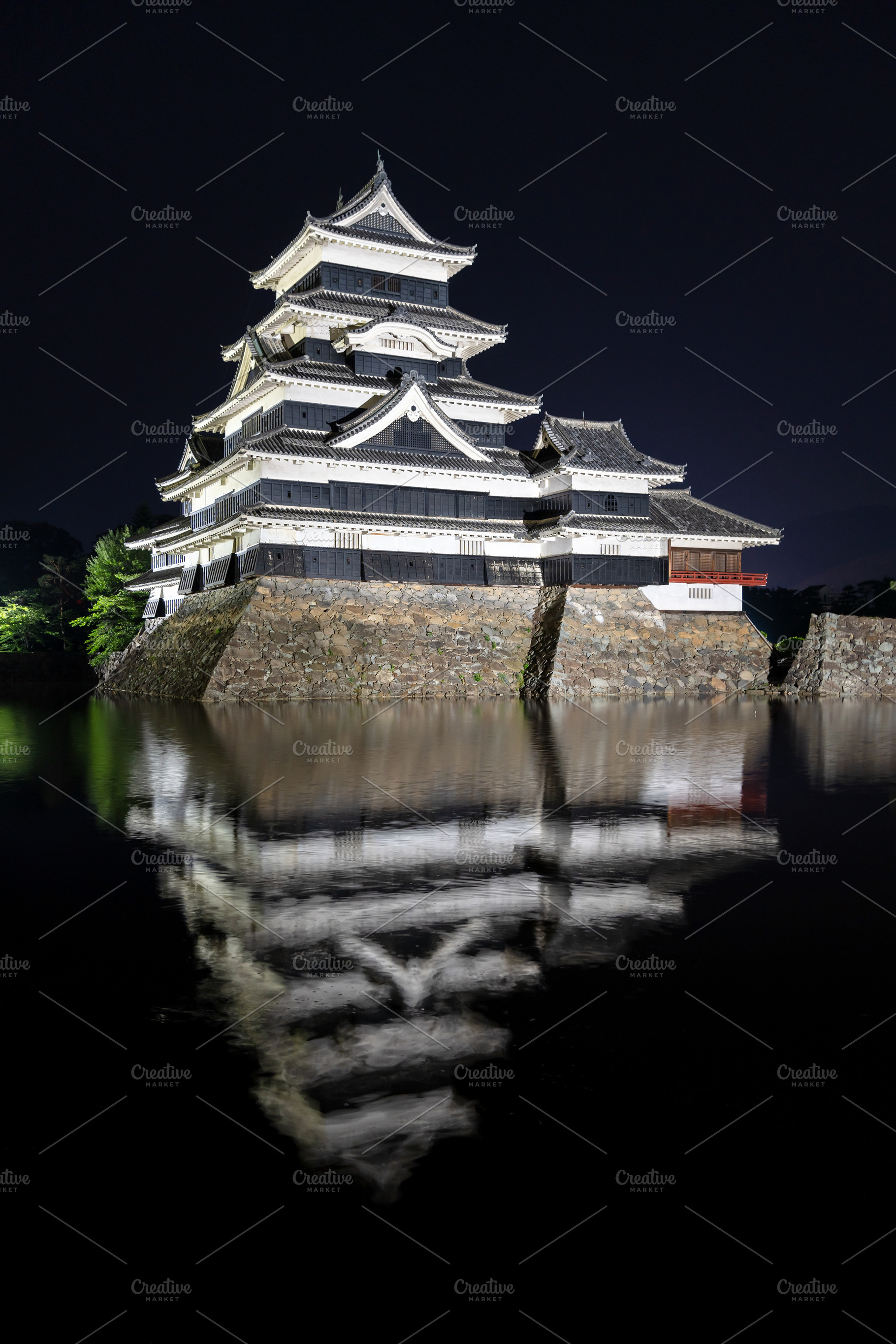 Night view of Matsumoto Castle reflecting in the water, Japan, an Architecture Photo by GoodGoods