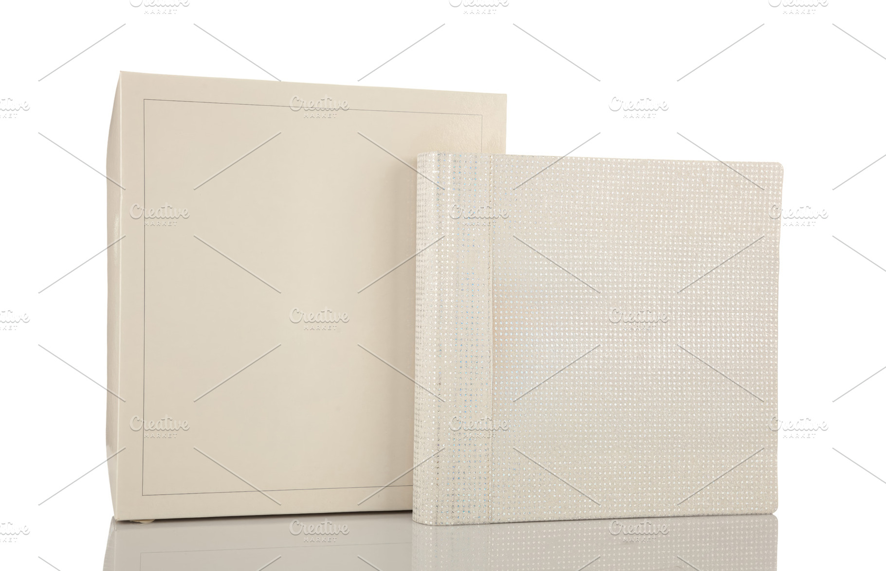 Elegant white wedding photo album and its box reflecting on a white background, an Abstract Photo by Antonio Gravante Market