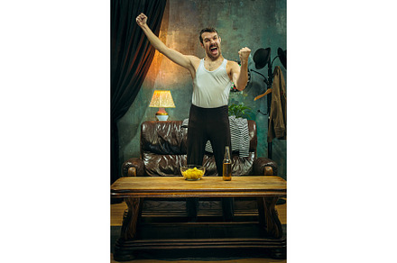 Winner overwhelmed cheerful man featuring match, fan, and football, a Sports & Recreation Photo by Volodymyr Melnyk