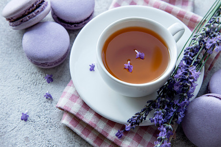 Cup of tea with macaroon dessert with lavender flavor, a Food & Drink Photo by Olena Rudo