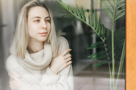 Sad girl near window thinking about something, a Person Photo by Olena Rudo