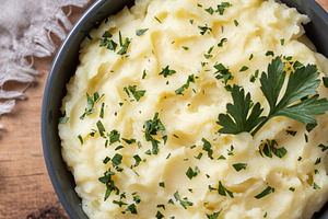 Creamy mashed potatoes in black bowl, a Food & Drink Photo by etorres69